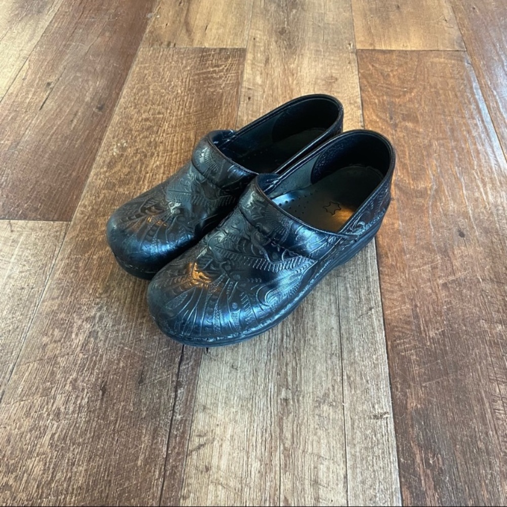 Black embossed leather Dansko clogs